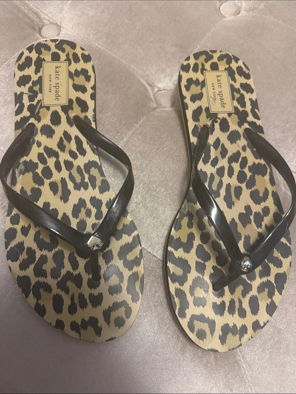 Kate Spade black strap flip-flops with spade logo